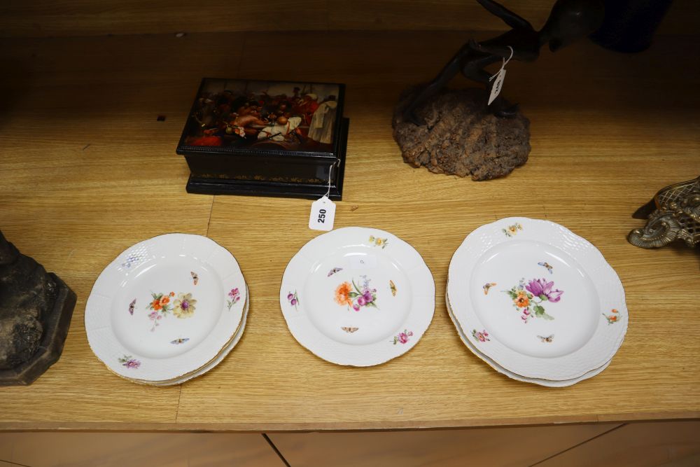 A set of eight Berlin plates, decorated with butterflies and flowers, diameter 21cm (5) and 24cm (3)